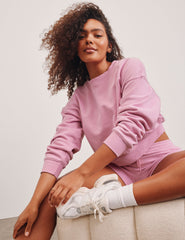 pink crew neck loose-fitting classic length sweatshirt.
