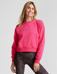 pink crewneck loose-fitting classic length sweatshirt.