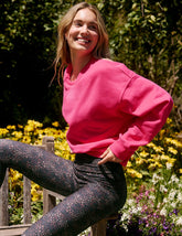 pink crewneck loose-fitting classic length sweatshirt.