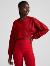 red cropped crew neck loose fitting sweatshirt.