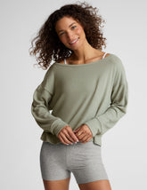green classic length long sleeve sweater with a wide off-the-shoulder neckline.