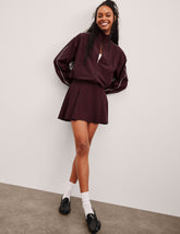 red mini skirt with built-in shorts with pockets.