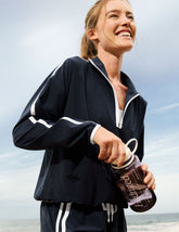 blue pullover with a half zip front and front kangaroo pocket.