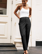 black trouser style pant with a tapered ankle and pockets.