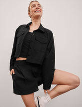 black 4" inseam shorts with an elastic waistband with belt loops and side seam pockets.