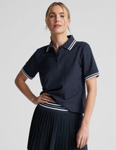 blue fitted polo style short sleeve t-shirt with a stripe rib collar and cuff, front placket with buttons, and side slits.