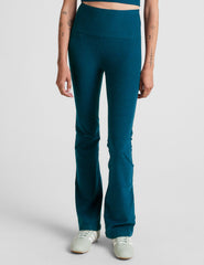 blue high-waisted bootcut pants.