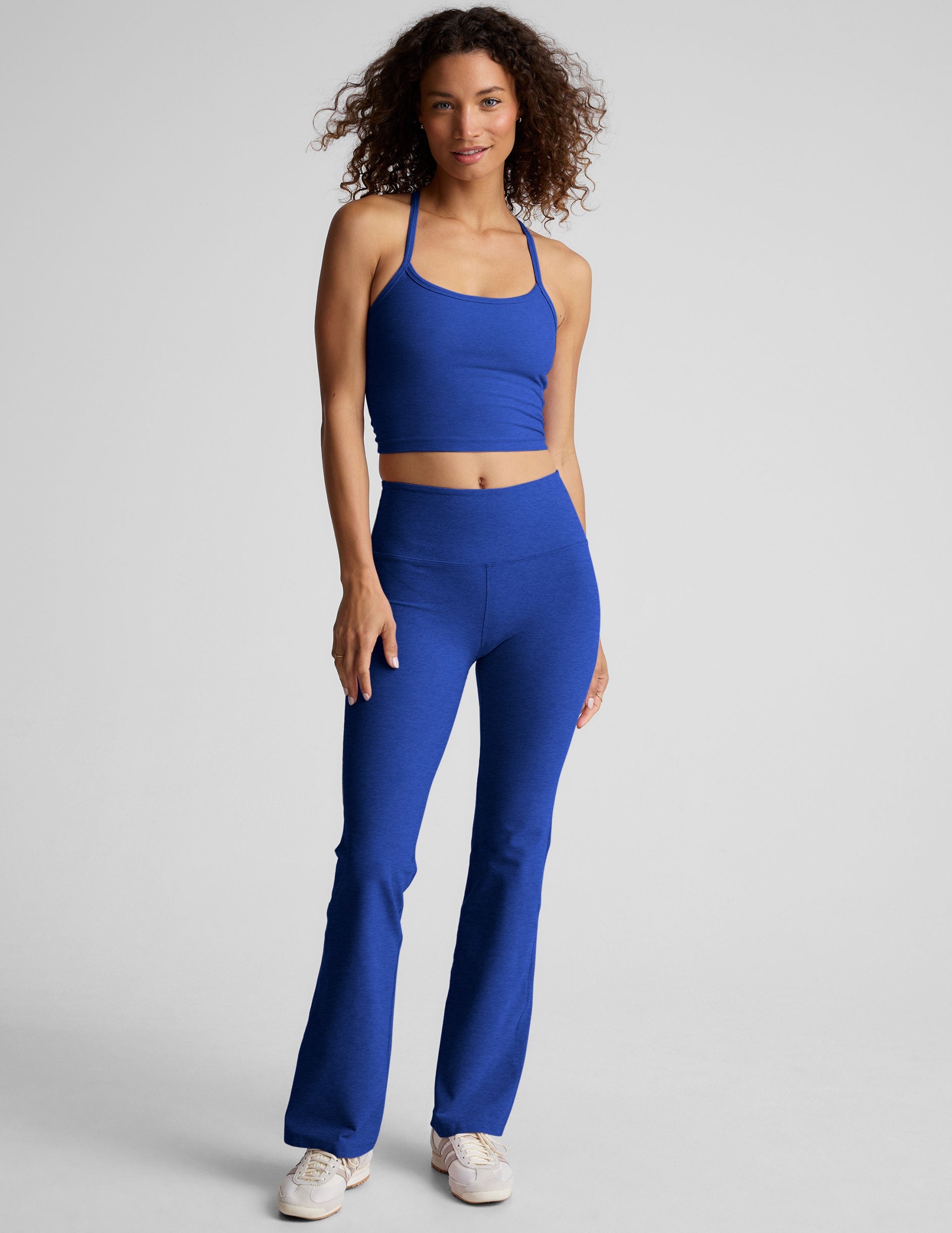 blue high-waisted bootcut pants.