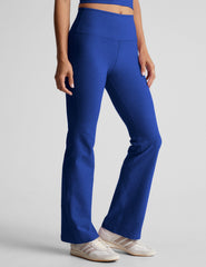 blue high-waisted bootcut pants.