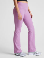 purple high-waisted bootcut pants.