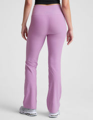 purple high-waisted bootcut pants.