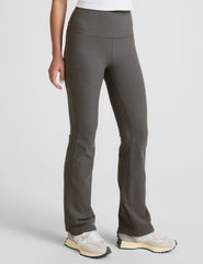 grey high-waisted bootcut pants.
