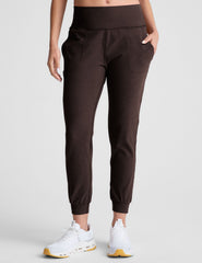 brown high-waisted midi length joggers with pockets.