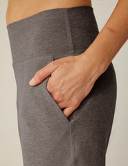 brown high-waisted midi length joggers with pockets.