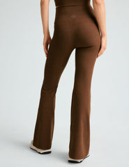 brown high-waisted flare pants with side pockets.