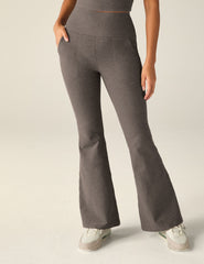 brown high-waisted flare pants with pockets.