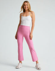 model is wearing pink high-waisted high-rise pants.