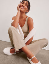 light brown high-waisted cropped flare pants.