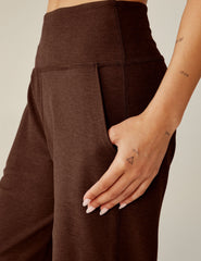 brown high-waisted wide leg pants with pockets.