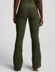 green mid-rise bootcut pants.