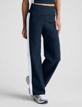blue wide leg pants with a 4" waistband and white contrast panels on sides.