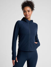 blue zip-up hooded jacket with thumbholes.