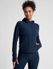blue zip-up hooded jacket with thumbholes.