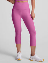 pink high-waisted capri length leggings.