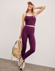 purple high-waisted midi length leggings.