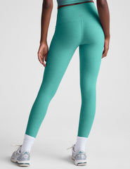 blue high-waisted midi length leggings.