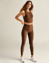 brown high-waisted midi length leggings.