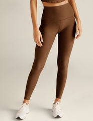 brown high-waisted midi length leggings.