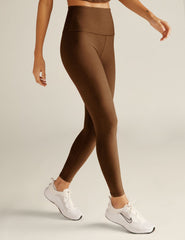 brown high-waisted midi length leggings.