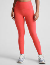 pink high-waisted midi length leggings.