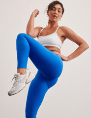 blue high-waisted midi length leggings with a 24" inseam and 5" rise waistband.