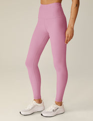 pink high-waisted midi leggings.