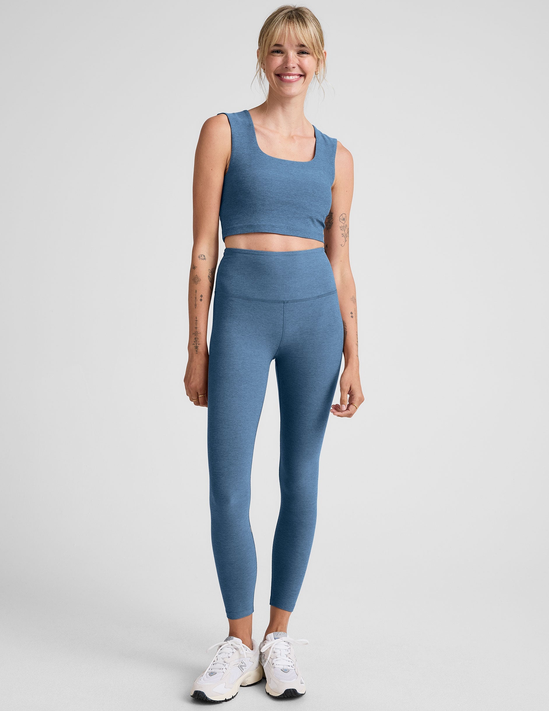 blue high-waisted midi length legging.