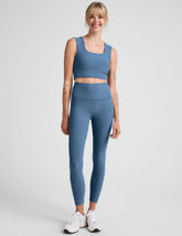 blue high-waisted midi length legging.