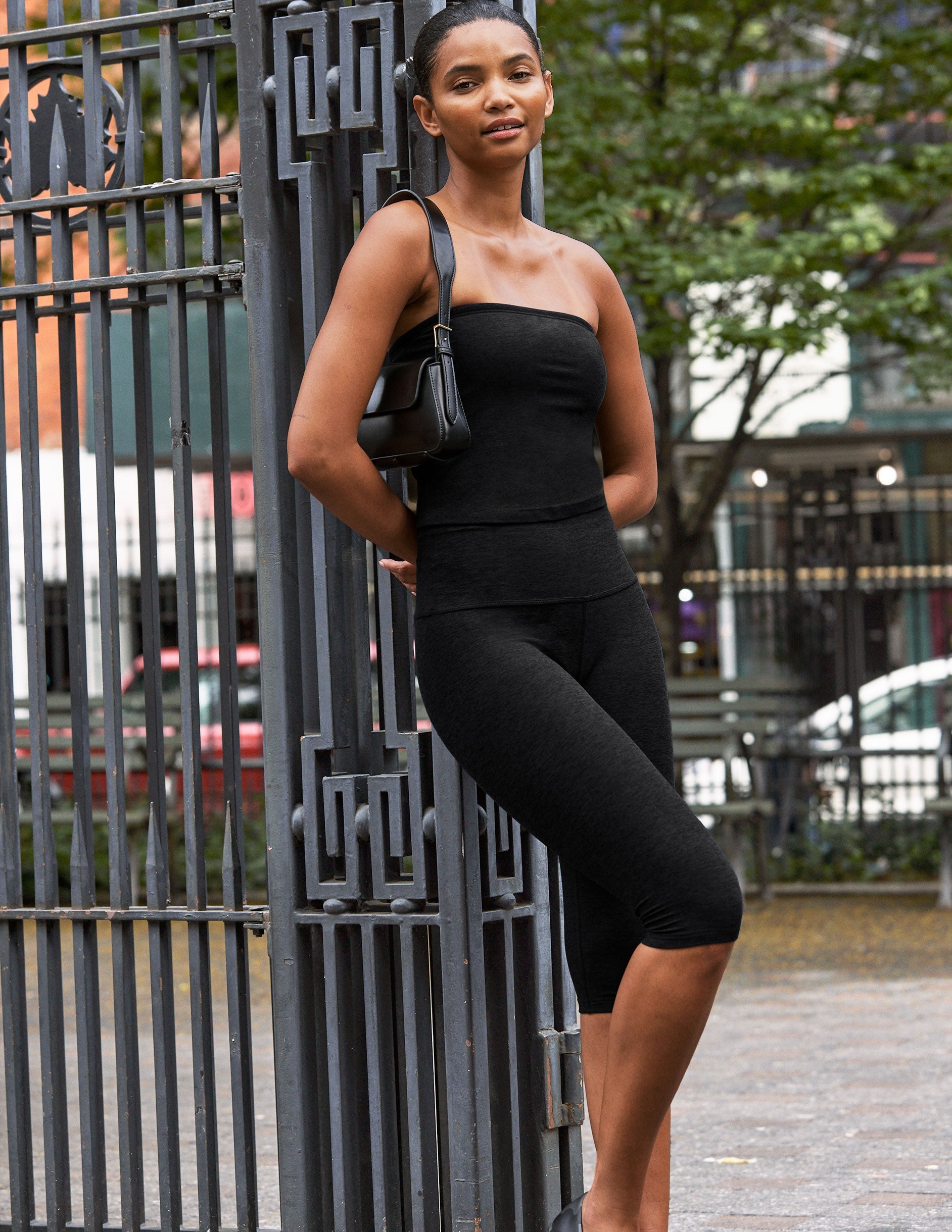 black high-waisted pedal pusher length leggings.