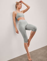gray high-waisted pedal pusher length leggings.