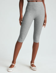 gray high-waisted pedal pusher length leggings.