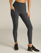 black charcoal high-waisted midi leggings with pockets.