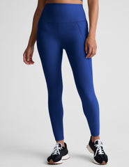 blue high-waisted midi length leggings with side pockets.
