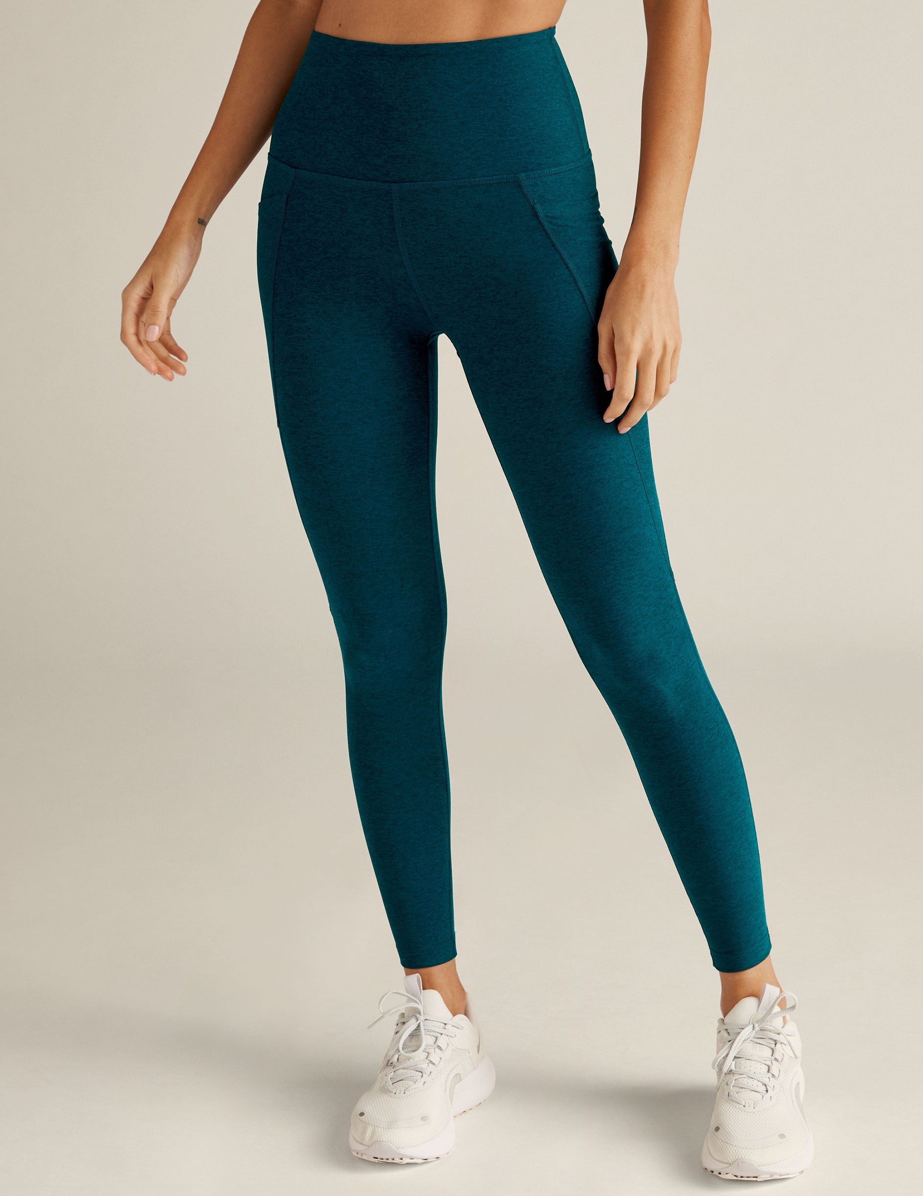 blue high-waisted midi spacedye leggings with side pockets.