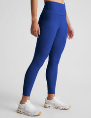 blue high-waisted midi leggings with a crossover detail on the front waistband.