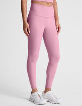 pink high-waisted midi leggings with a crossover detail on the front waistband.