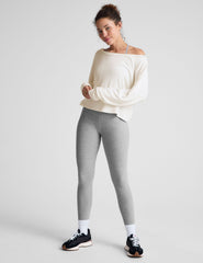 gray high-waisted midi length leggings with a crossover detail on the front waistband.