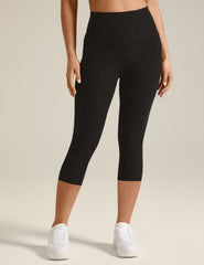 black capri midi legging with pockets at sides.
