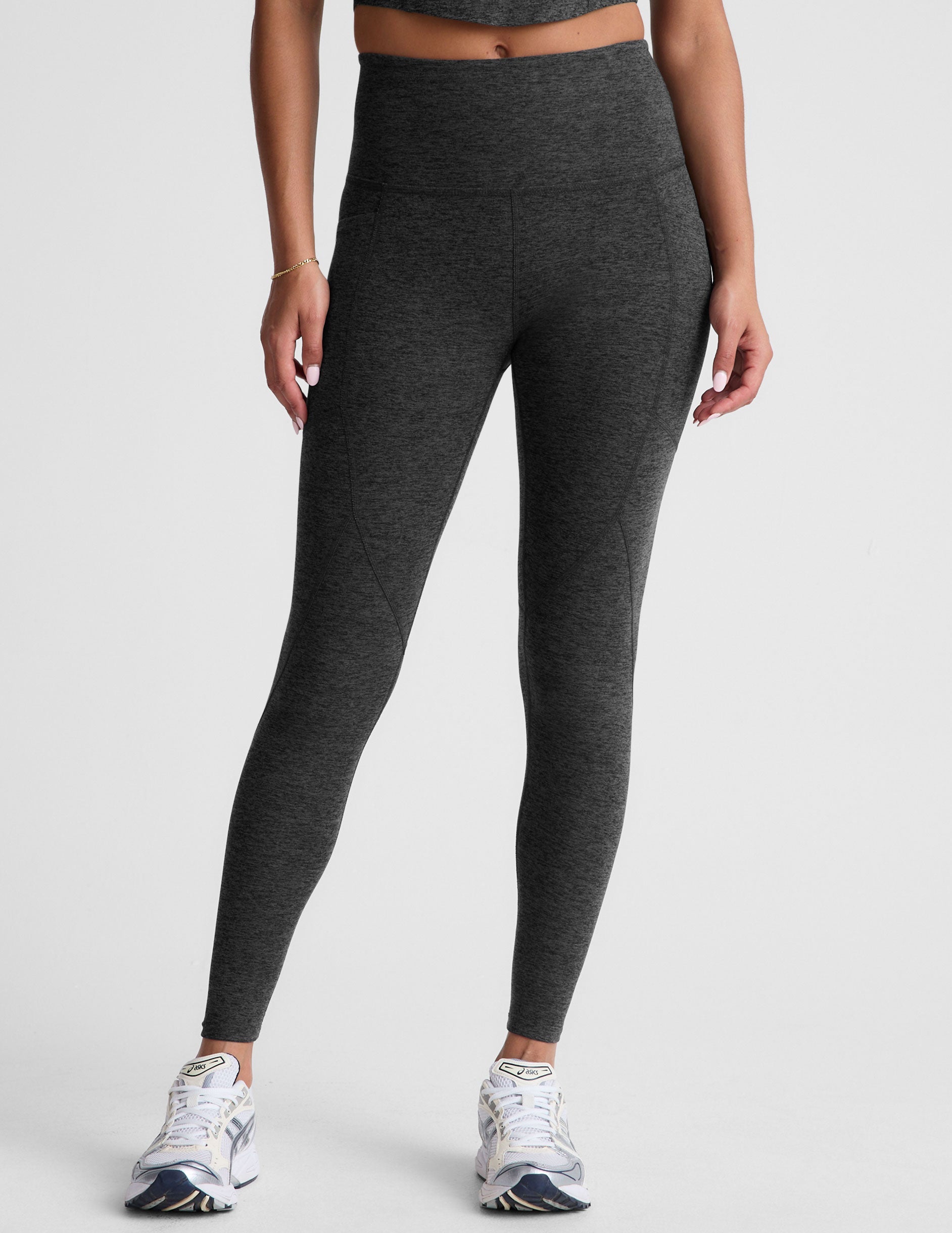 black-charcoal high-waisted midi leggings with side pockets.