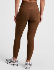 brown high-waisted midi length leggings with a drawstring at waistband and side pockets.